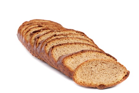 Slices of brown bread. Isolated on a white backgroundの写真素材