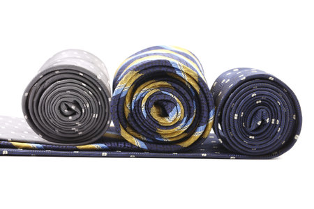 Three rolls of multi-colored tie. Isolated on a white background.