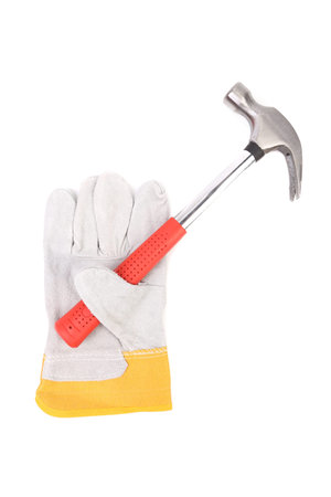 Protection glove holding hammer. Isolated on white background.の写真素材