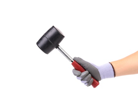 Hand holding hammer. Isolated on a white background.の写真素材