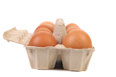 Eggs in protective case foreground close-up. 