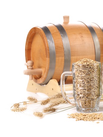 Barrel and a mug with barley. Isolated on a white background. Place for text.の写真素材