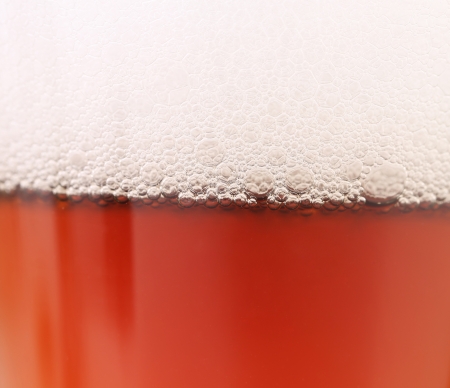 Close up of beer with foam. Whole background.の写真素材