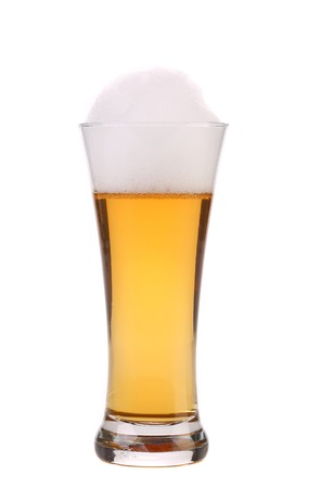 Full glass of beer with foam. Isolated on a white background.の写真素材