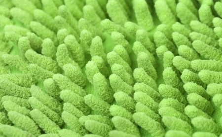 Background of a green carpet. Isolated on a white backgroundの写真素材