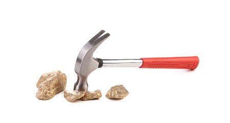Closeup of hammer with rocks. Isolated on white background.の写真素材