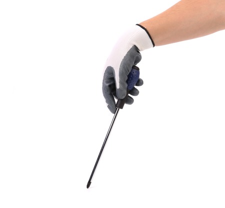 Hand in glove holding screwdriver. Isolated on a white background.の写真素材