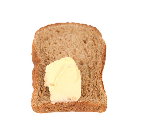 Slice of bread with butter.  Isolated on a white background
