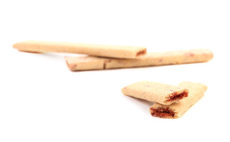 Broken biscuit sticks with filling. Isolated on a white background.の写真素材