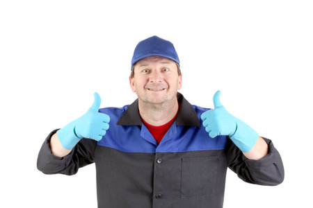 Working man with thumbs up. Isolated on a white background.の写真素材