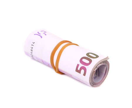 Rolled five hundreds euro banknotes. Isolated on a white backgroundの写真素材