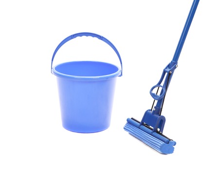 Washing the floor with cleaning tools. Isolated on a white background.の写真素材