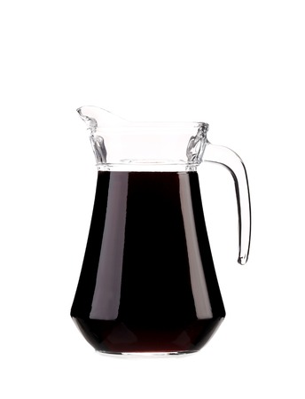 Decanter full with red wine. Isolated on a white background.の写真素材