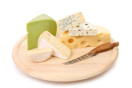 Composition of cheese on wooden plate. Isolated on a white background.の写真素材