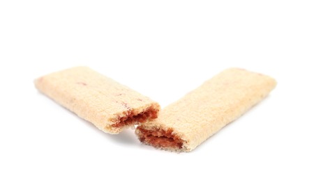 Broken biscuit sticks with filling. Isolated on a white background.の写真素材