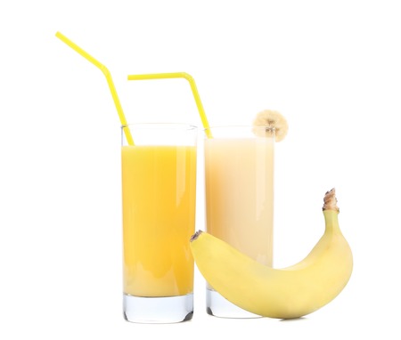 Juices of orange and banana. Fruits. Isolated on a white background.の写真素材