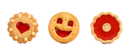 Thre different cookies with jam in row. Isolated on a white background.の写真素材