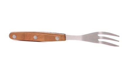 Close up of kitchen fork. Isolated on a white background.の写真素材