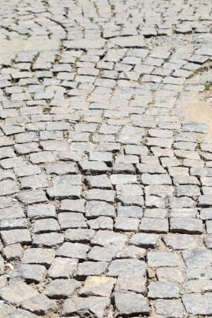 Stone road texture. Cobblestones. Closeup. Whole background.の写真素材