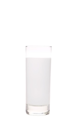 Close up of tall glass of milk. Isolated on a white background.の写真素材