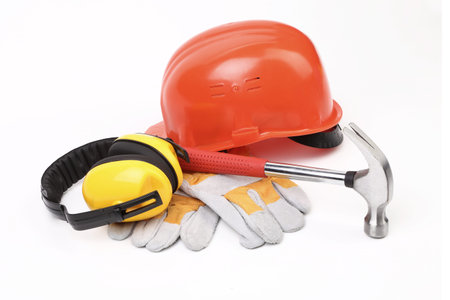 Red hard head gloves and tools. Isolated on a white background