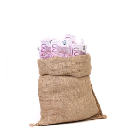 Bag full with of euro bills. Isolated on a white background.の写真素材