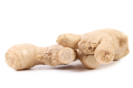 Close up of fresh ginger root. Isolated on a white background.