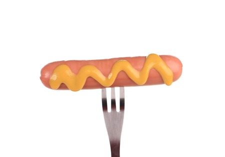 Grilled sausage on a fork  Isolated on a white background の写真素材