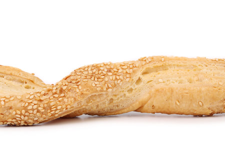 Close up of cheese sticks with seeds. Isolated on a white background.