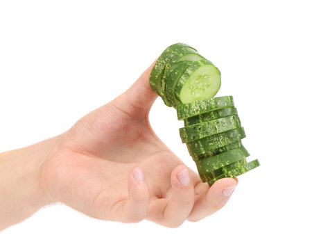 Hand holds stack juicy cucumber  Isolated on a white background の写真素材