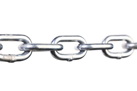 Close up of links a chain. Isolated on a white background.の写真素材