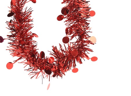 Christmas red tinsel. Isolated on a white background.の写真素材