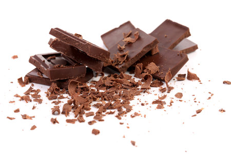 Chocolate bars and shaving.  Isolated on white backgroundの写真素材