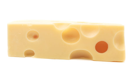 Close up of cheese slice. Isolated on a white background.の写真素材