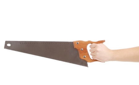 Close up of hand in gloves with saw. Isolated on a white background.の写真素材