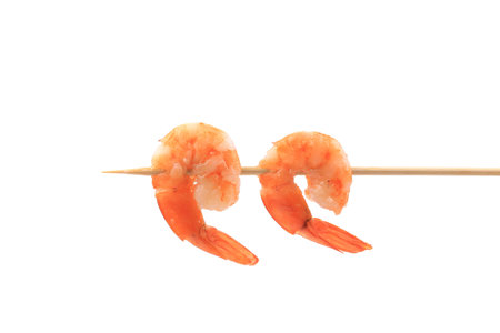 Grilled shrimps on a stick. Isolated on a white background.の写真素材