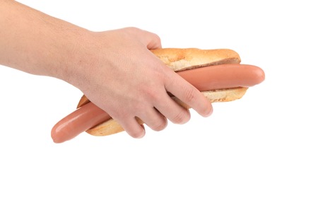 Hand hold hotdog. Isolated on a white backgroundの写真素材