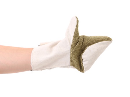 Glove hand of a construction on white backgroundの写真素材
