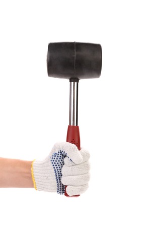 hand with rubber mallet on white backgroundの写真素材