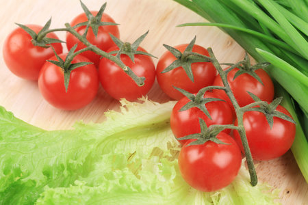 Composition of tomatoes cherry and onion. Whole background.の写真素材