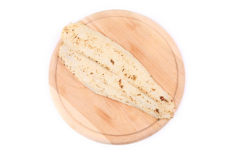 Fresh grilled fillet of pangasius. Isolated on a white background.