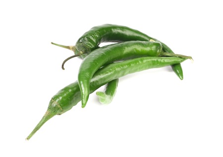 Four green peppers. Isolated on a white background.の写真素材