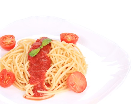 close up of spaghetti with tomato sauce and basil. isolated on a white の写真素材