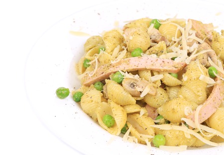 pasta shells with vegetables and sausage on a white plate. isolated on a white backgroundの写真素材