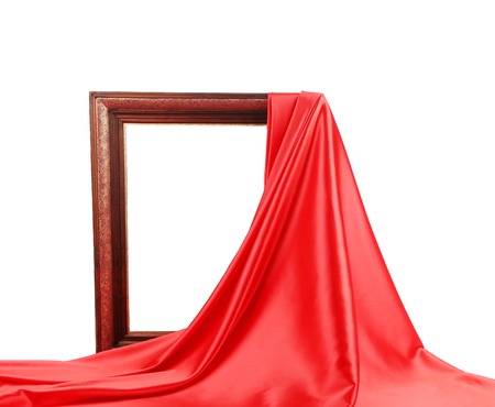 Wooden frame with red silk. On a white background.の写真素材