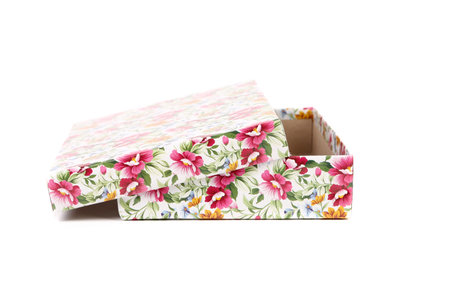 white Gift box with red blue and orange flowers. Isolated on a white background