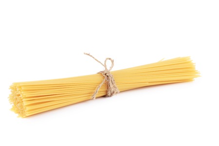 Bunch of uncooked spaghetti. Isolated on a white background.の写真素材