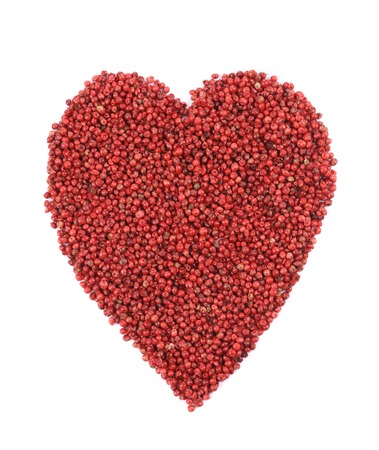 Dried red pepper in shape of heart. Isolated on a white background.の写真素材