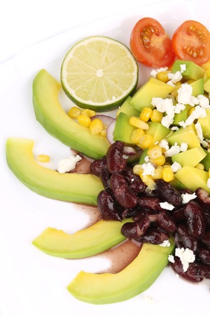 Red beans salad with avocado. Isolated on a white background.の写真素材