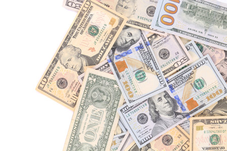 Heap of dollar bills. Isolated on a white .